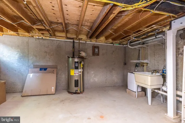 a view of storage and utility room with a utility room