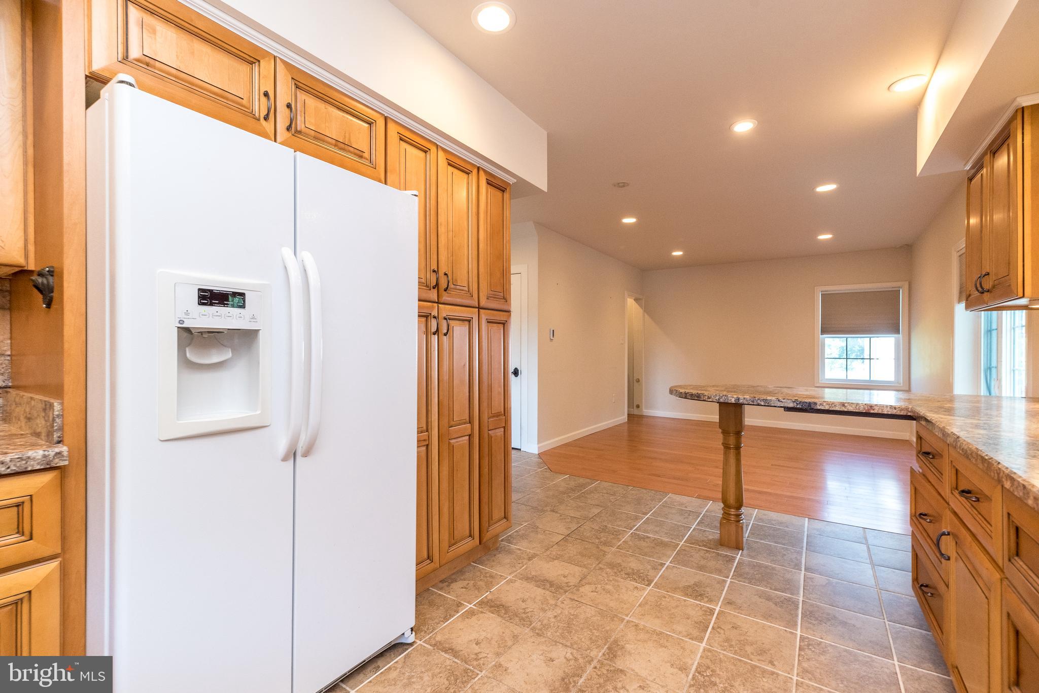 2478 River Road, Unit CARRIAGE New Hope, PA 18938 - Photo 4 of 23 a view of a kitchen with a refrigerator and a sink