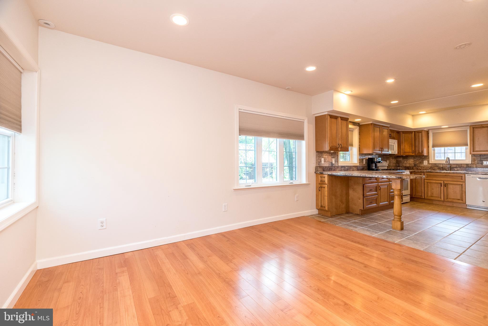 2478 River Road, Unit CARRIAGE New Hope, PA 18938 - Photo 7 of 23 a kitchen with stainless steel appliances kitchen island granite countertop a refrigerator sink and cabinets