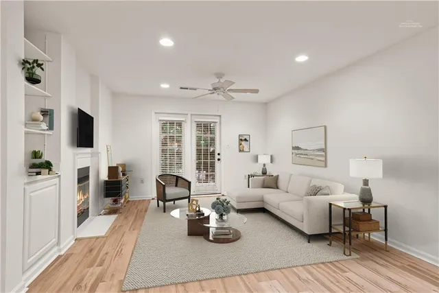 a living room with furniture fireplace and flat screen tv