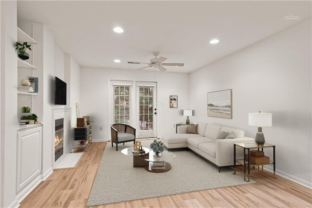 a living room with furniture fireplace and flat screen tv