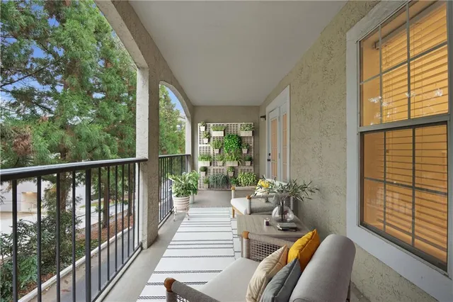 a view of a balcony with furniture