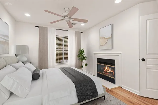 a bedroom with a bed and a fireplace