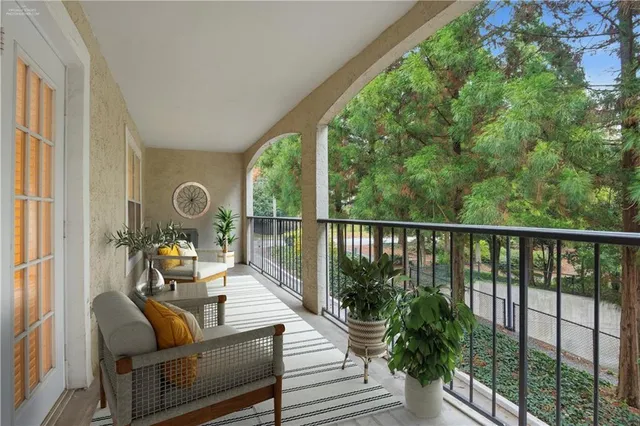 a view of balcony with furniture