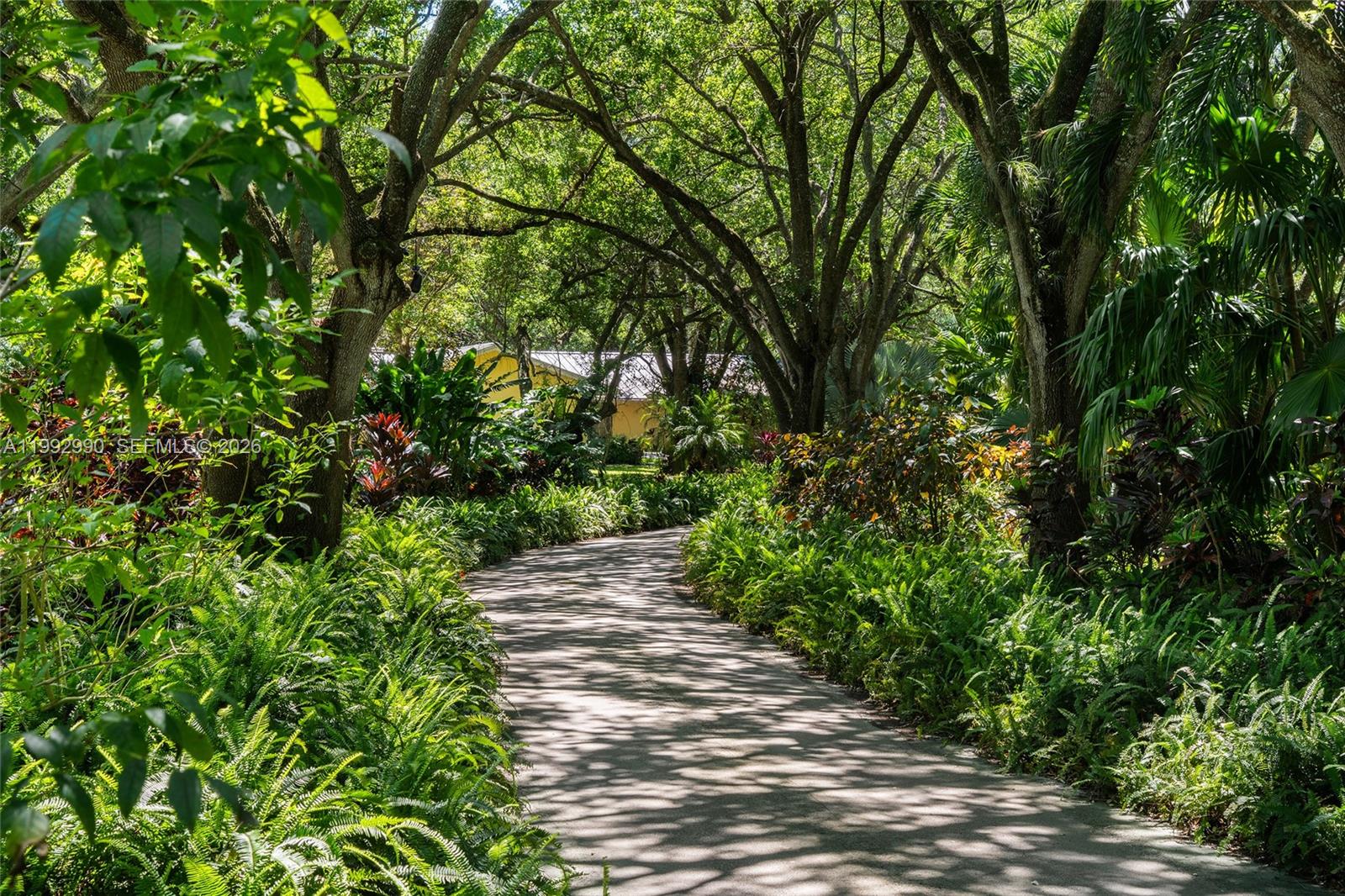 15000 Southwest 200th Street Miami, FL 33187 - Photo 17 of 76 a view of a pathway both side of yard