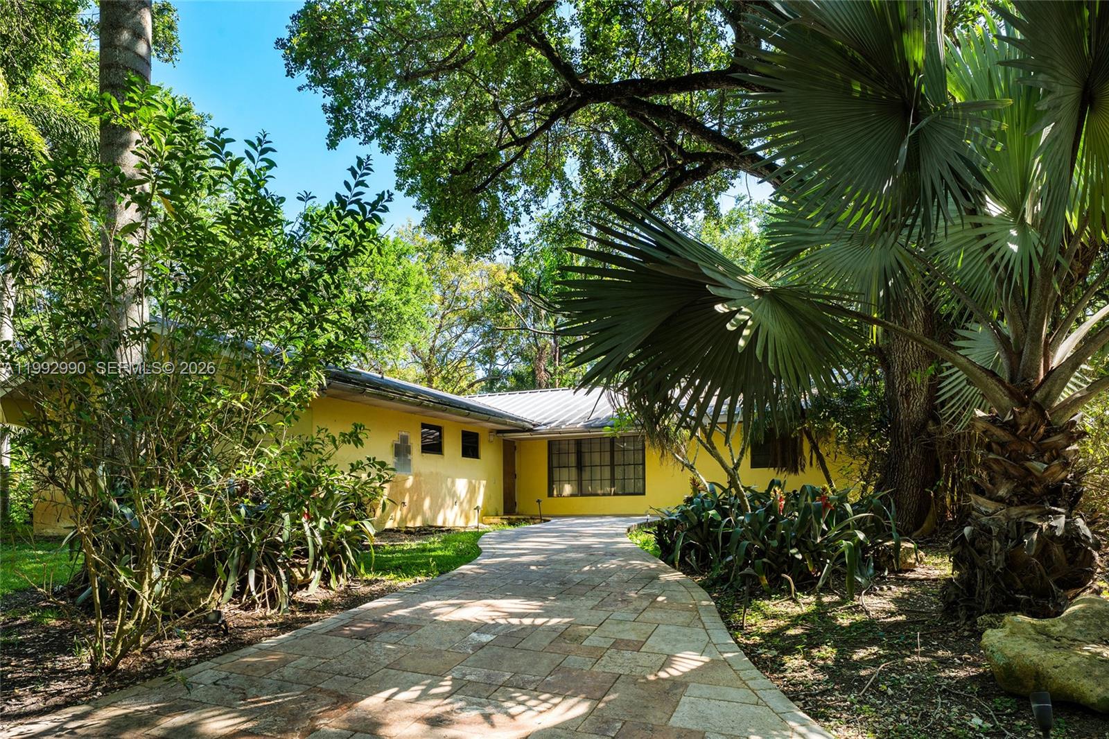 15000 Southwest 200th Street Miami, FL 33187 - Photo 19 of 76 a front view of a house with a garden