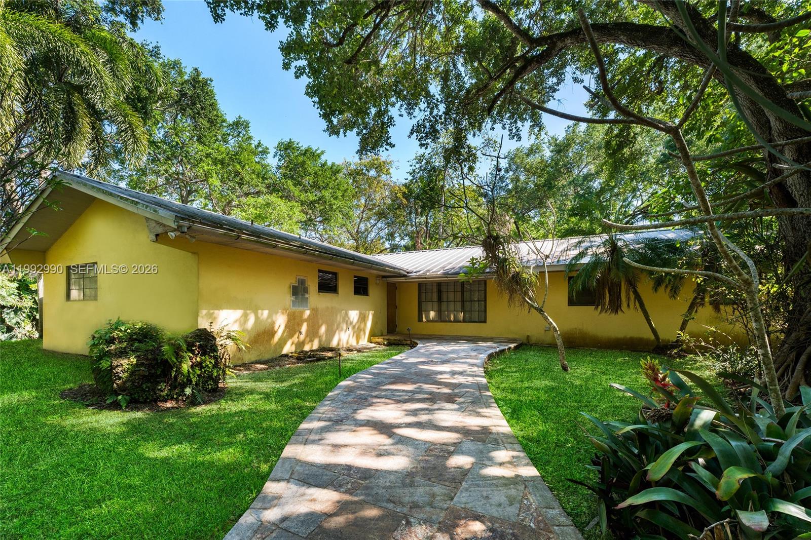 15000 Southwest 200th Street Miami, FL 33187 - Photo 20 of 76 a front view of a house with garden
