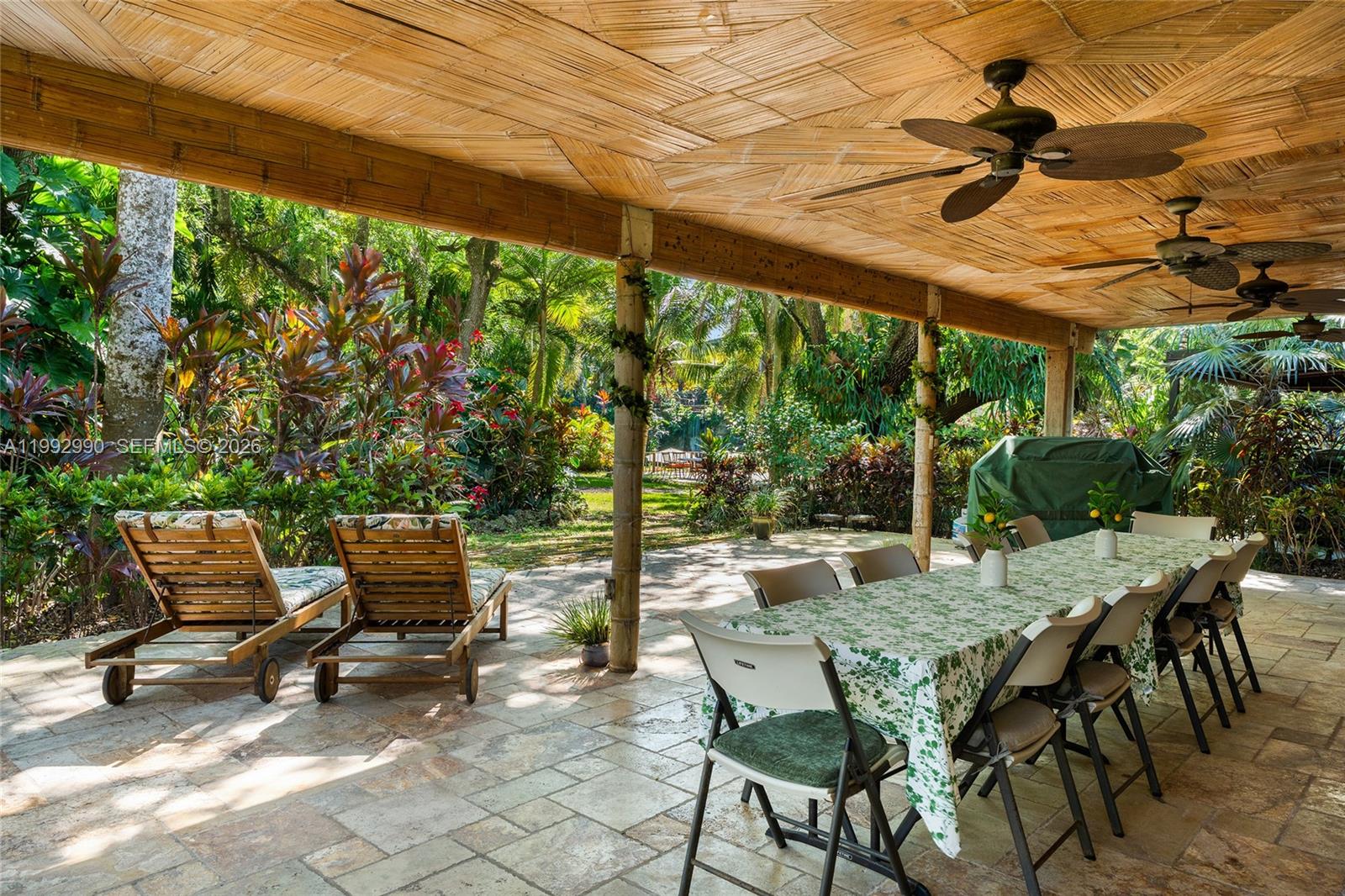 15000 Southwest 200th Street Miami, FL 33187 - Photo 22 of 76 a view of patio with table and chairs and potted plants