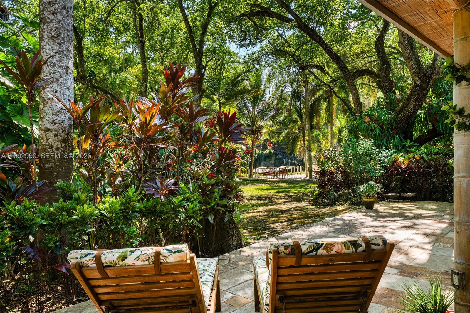 15000 Southwest 200th Street Miami, FL 33187 - Photo 23 of 76 a view of a yard with plants and a barbeque