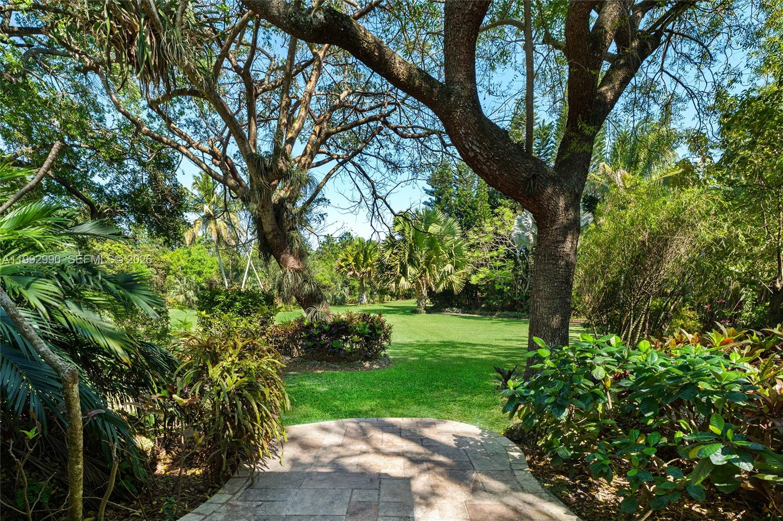 15000 Southwest 200th Street Miami, FL 33187 - Photo 24 of 76 a view of a yard with a tree