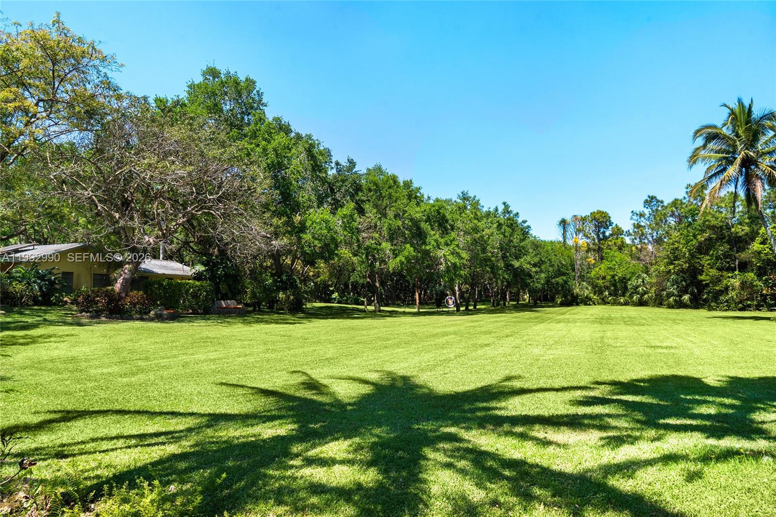 15000 Southwest 200th Street Miami, FL 33187 - Photo 27 of 76 a view of a grassy field with trees