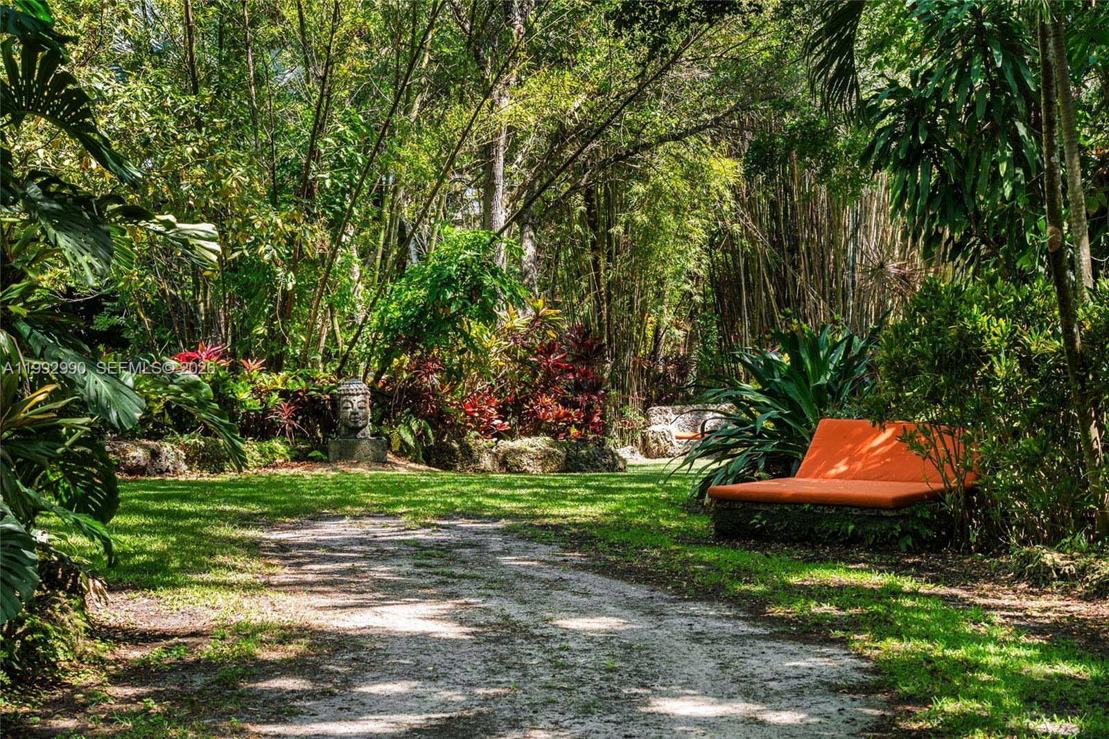 15000 Southwest 200th Street Miami, FL 33187 - Photo 30 of 76 a backyard of a house with yard and outdoor seating