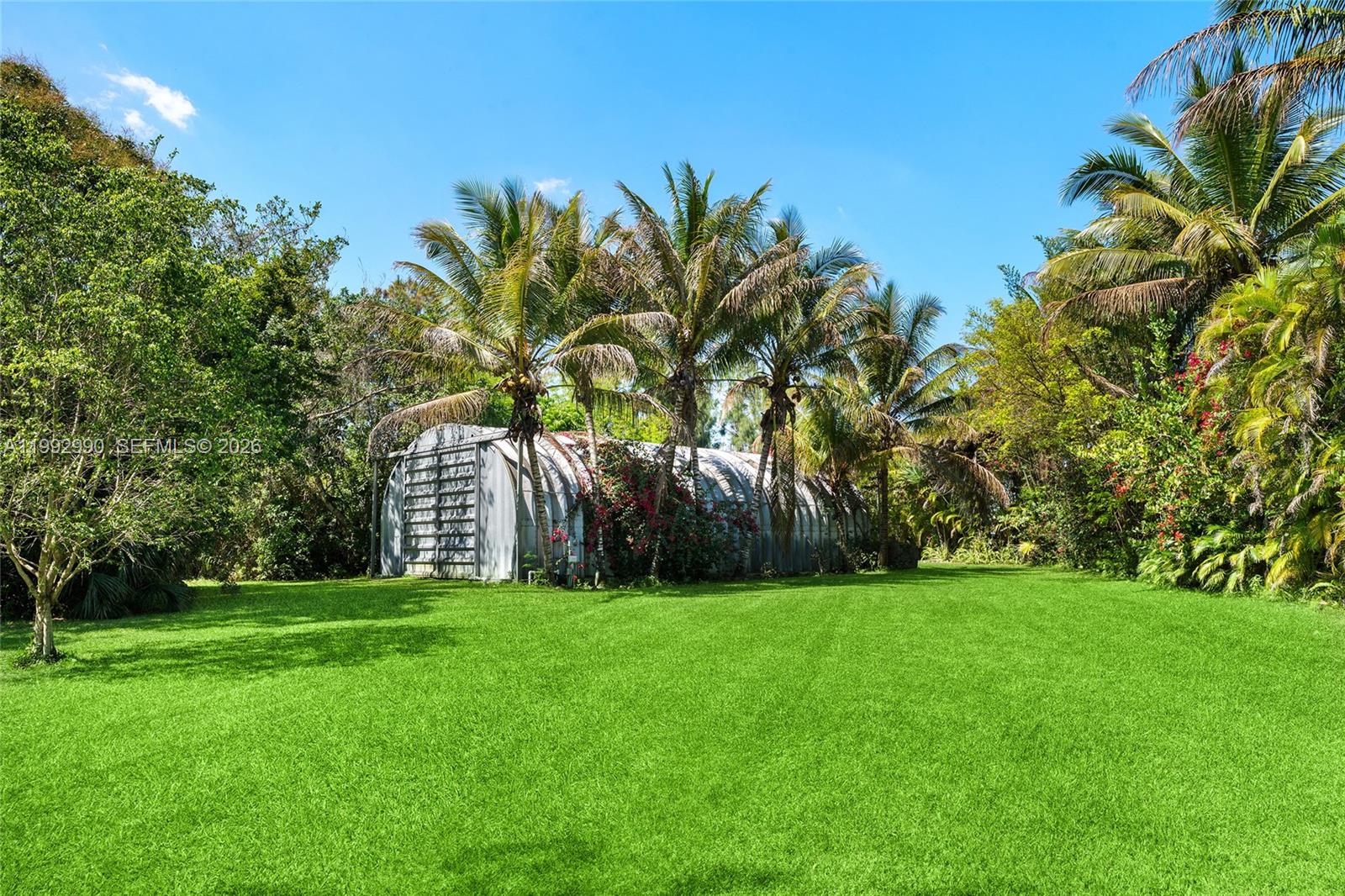 15000 Southwest 200th Street Miami, FL 33187 - Photo 50 of 76 a view of a backyard with a garden