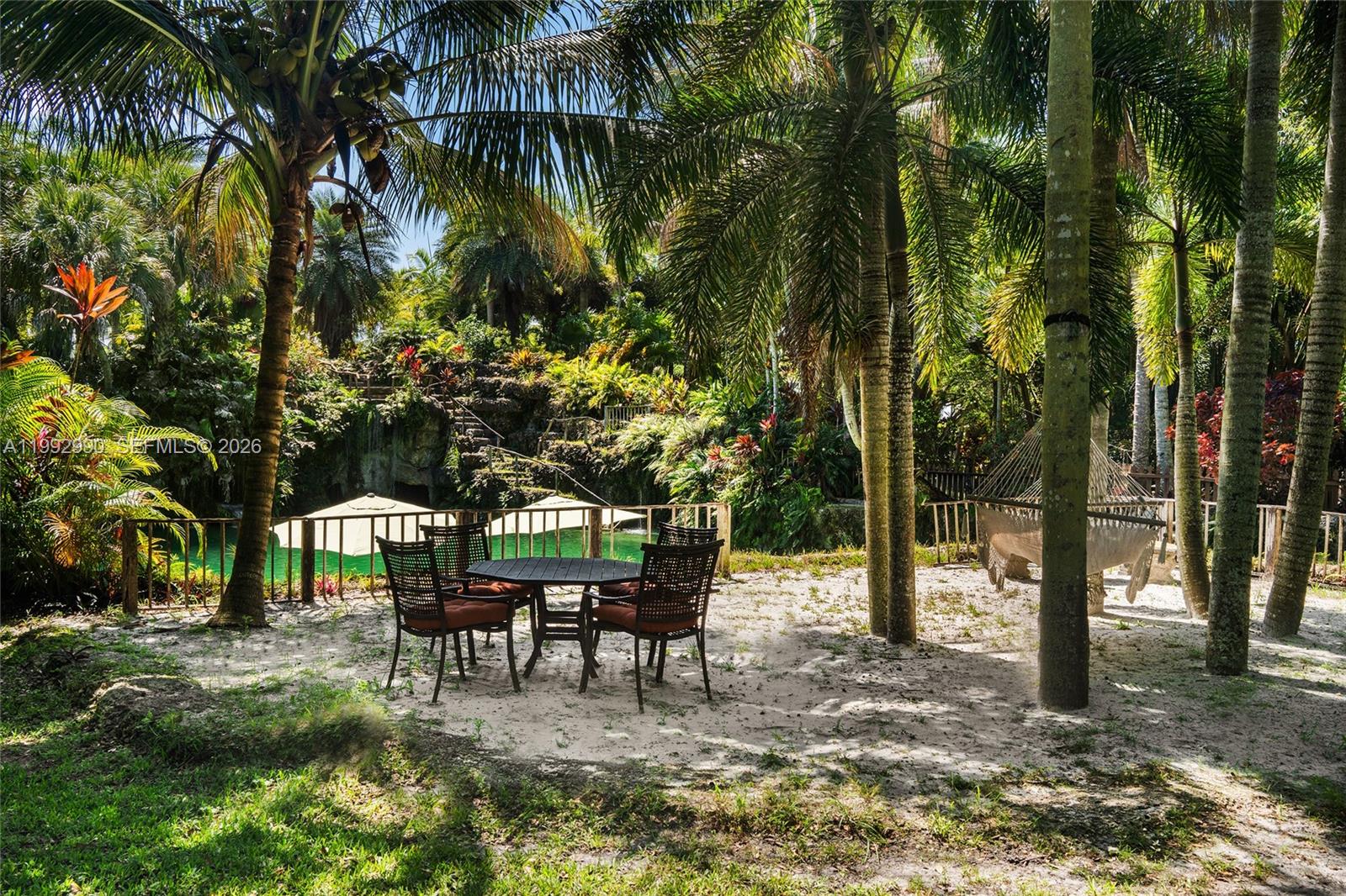 15000 Southwest 200th Street Miami, FL 33187 - Photo 5 of 76 a view of a yard with a table and chairs