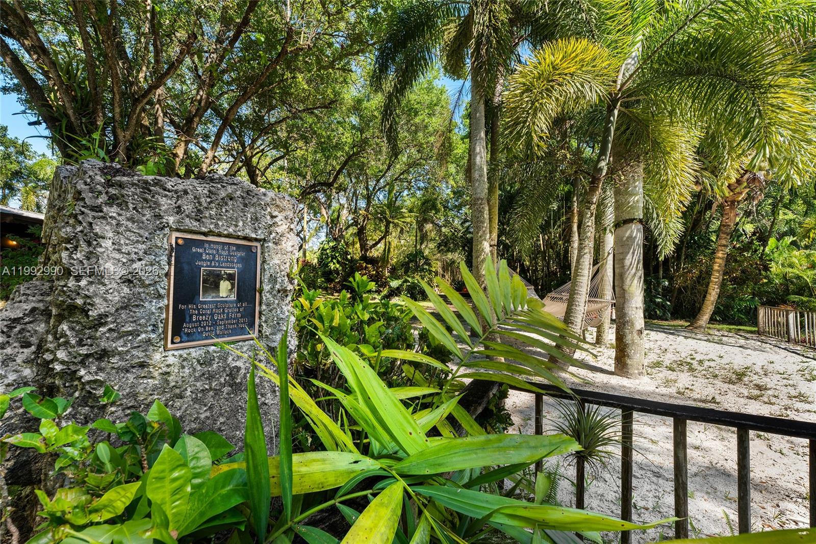 15000 Southwest 200th Street Miami, FL 33187 - Photo 6 of 76 a backyard of a house with lots of green space