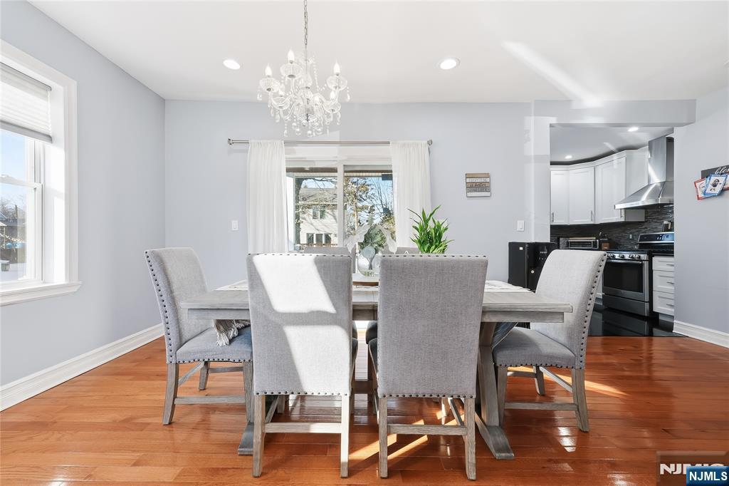 42 South Demarest Avenue Bergenfield, NJ 07621 - Photo 11 of 39 a view of a dining room with furniture wooden floor and chandelier