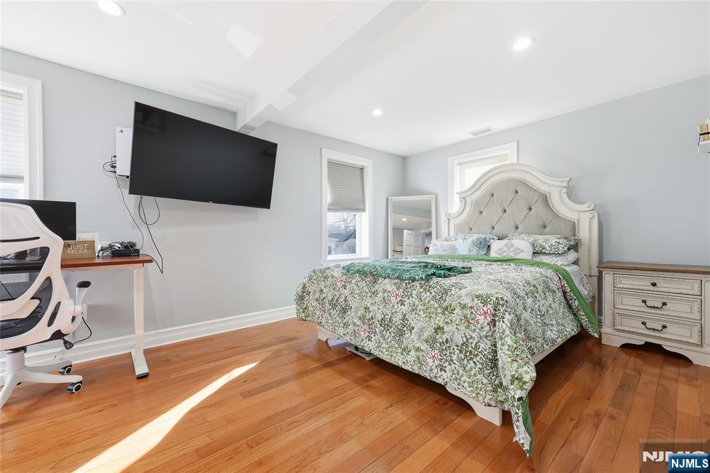 42 South Demarest Avenue Bergenfield, NJ 07621 - Photo 15 of 39 a bedroom with a bed and a flat screen tv