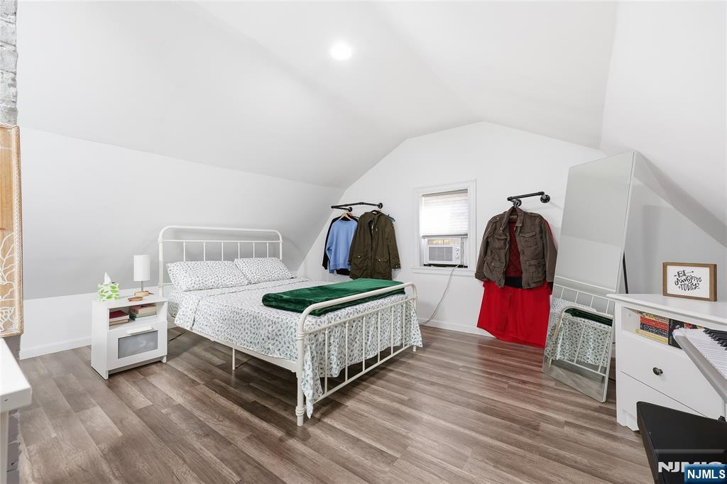 42 South Demarest Avenue Bergenfield, NJ 07621 - Photo 24 of 39 a bedroom with a bed and a flat tv screen on the dresser