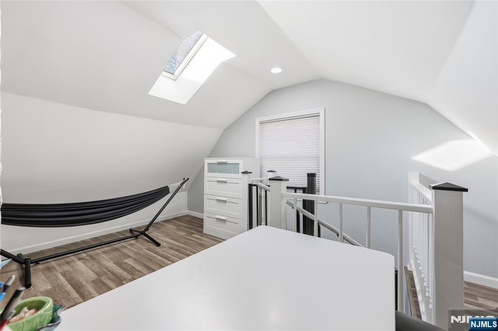 42 South Demarest Avenue Bergenfield, NJ 07621 - Photo 25 of 39 a living room with chairs and a wooden floor