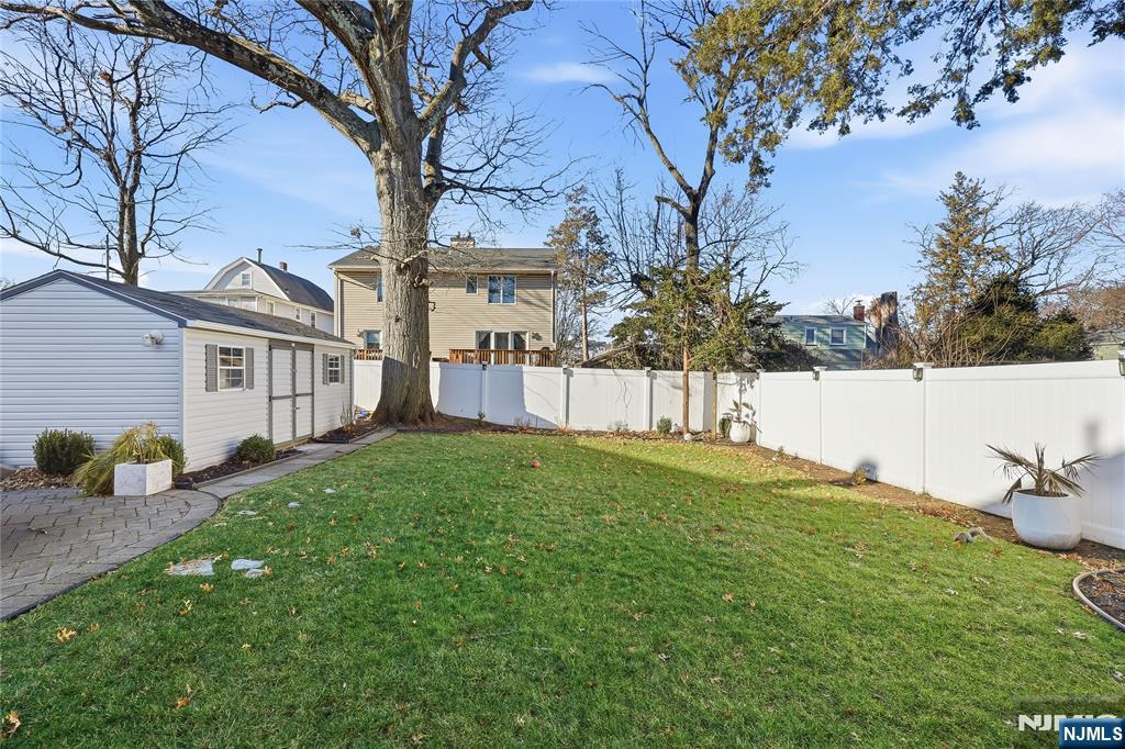 42 South Demarest Avenue Bergenfield, NJ 07621 - Photo 34 of 39 a view of backyard with a garden and trees