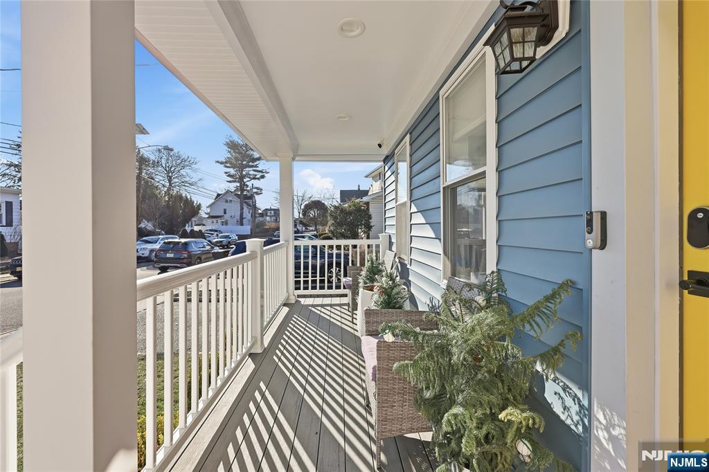 42 South Demarest Avenue Bergenfield, NJ 07621 - Photo 4 of 39 a view of a balcony with wooden floor