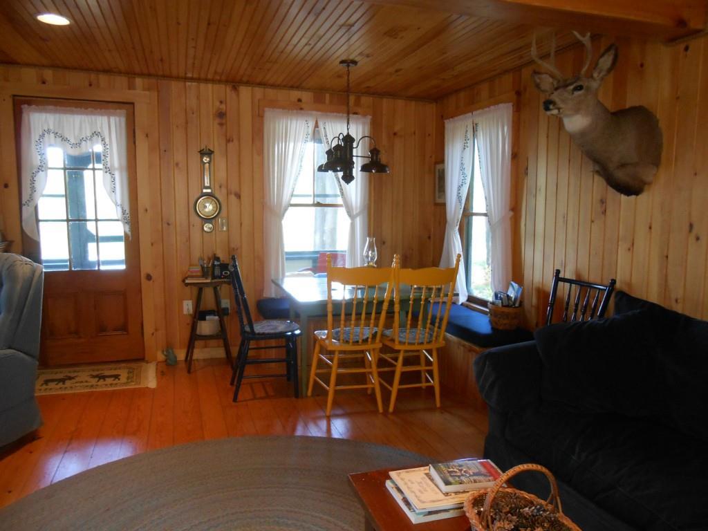 67 Camp Road Bryant Pond, ME 04219 - Photo 5 of 35 Built in seats with storage tucked...