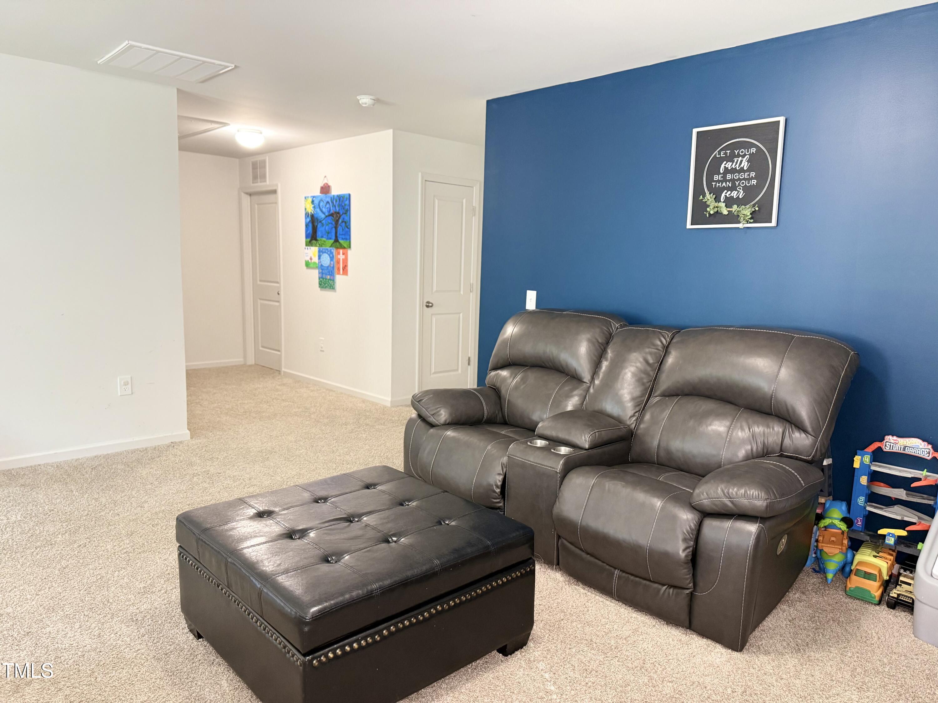 150 Riley Way Spring Hope, NC 27882 - Photo 16 of 27 a living room with furniture and a couch