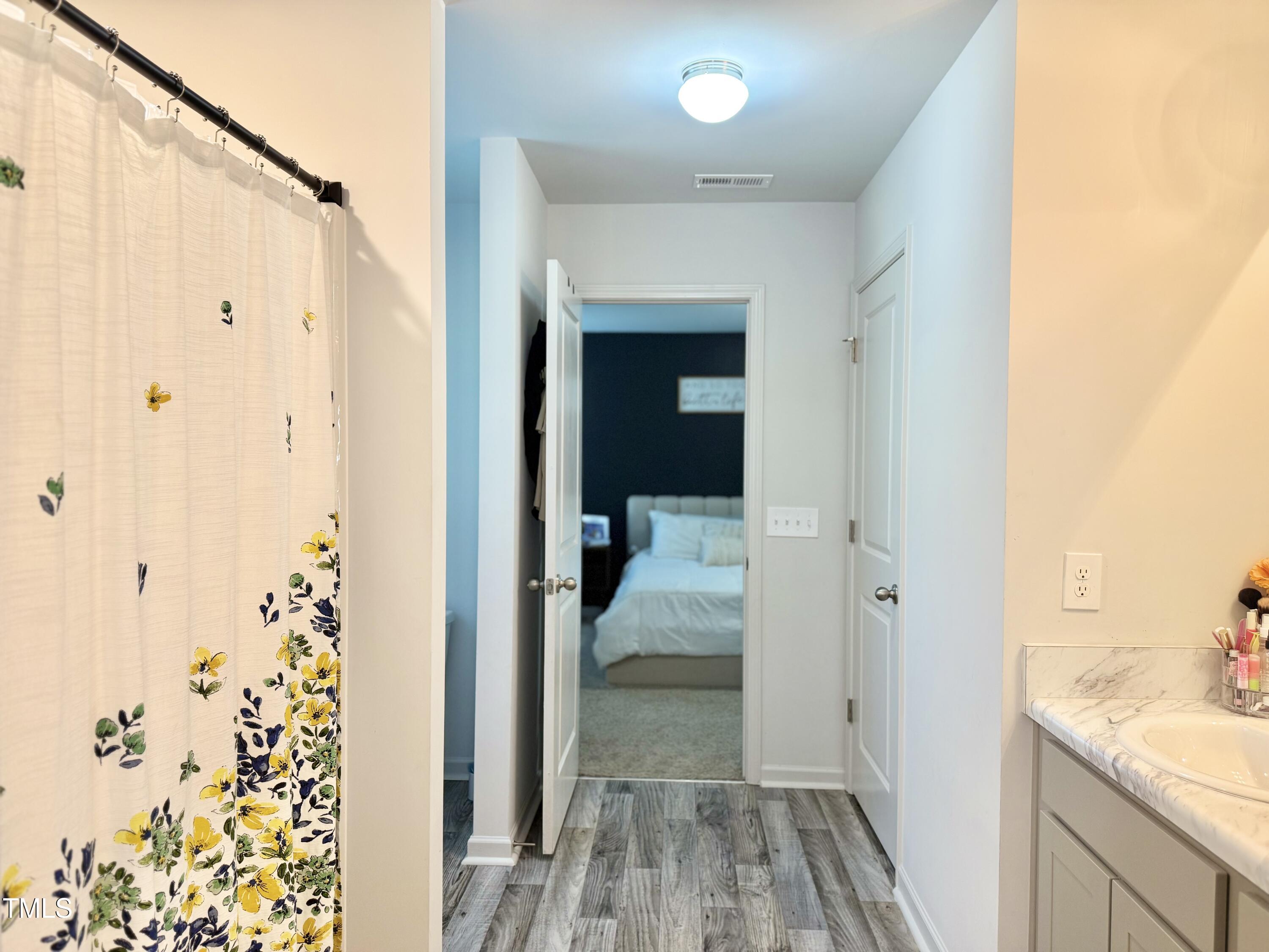 150 Riley Way Spring Hope, NC 27882 - Photo 20 of 27 a view of a hallway with a hardwood floor