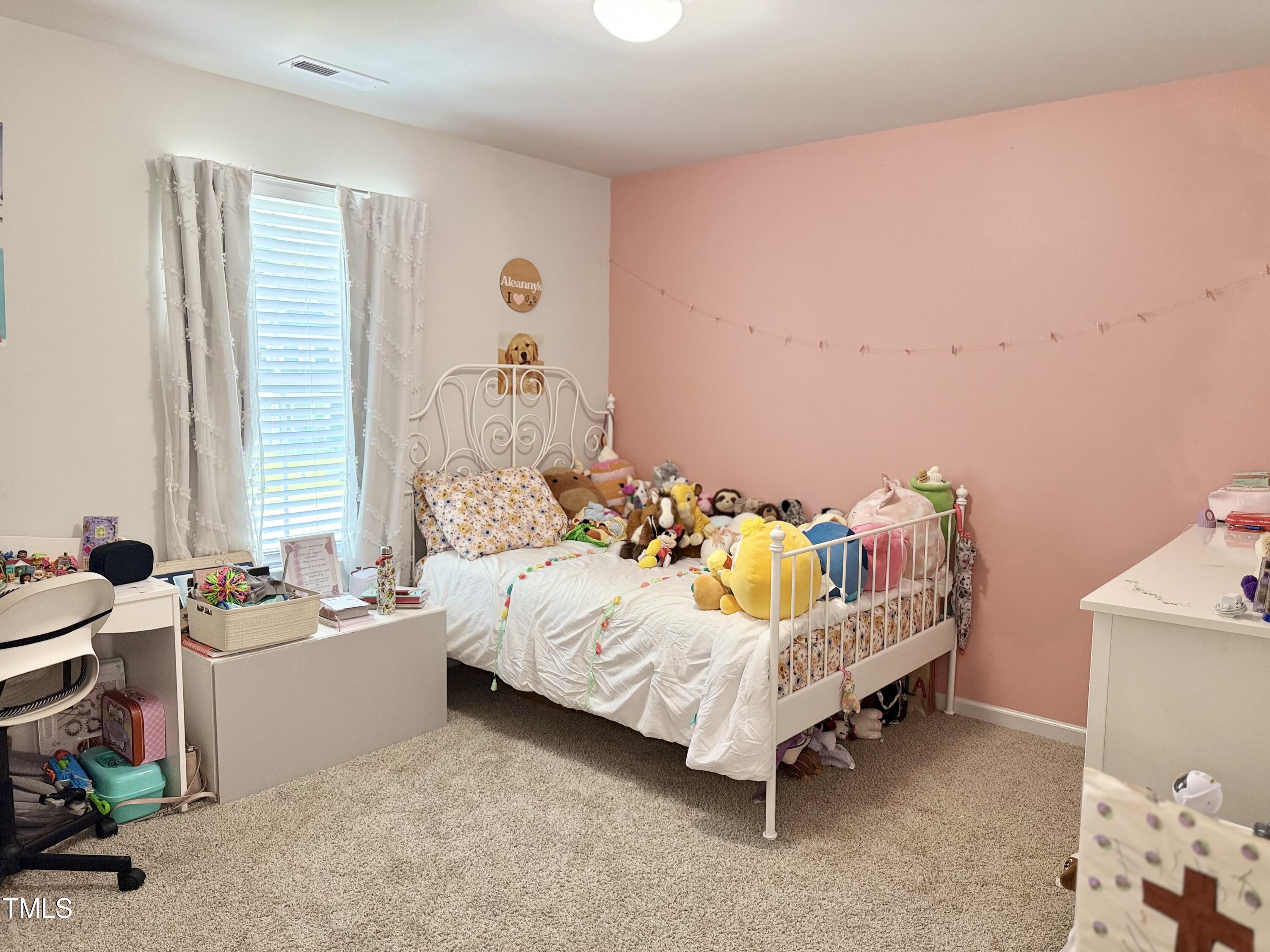 150 Riley Way Spring Hope, NC 27882 - Photo 23 of 27 a bed room with a bed and a chair