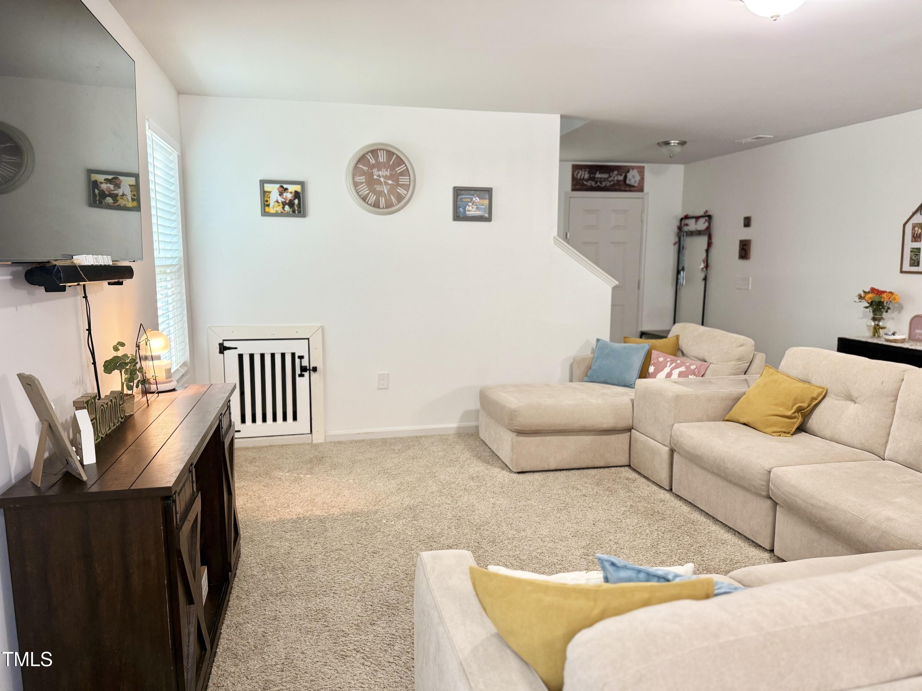 150 Riley Way Spring Hope, NC 27882 - Photo 9 of 27 a living room with furniture and a window