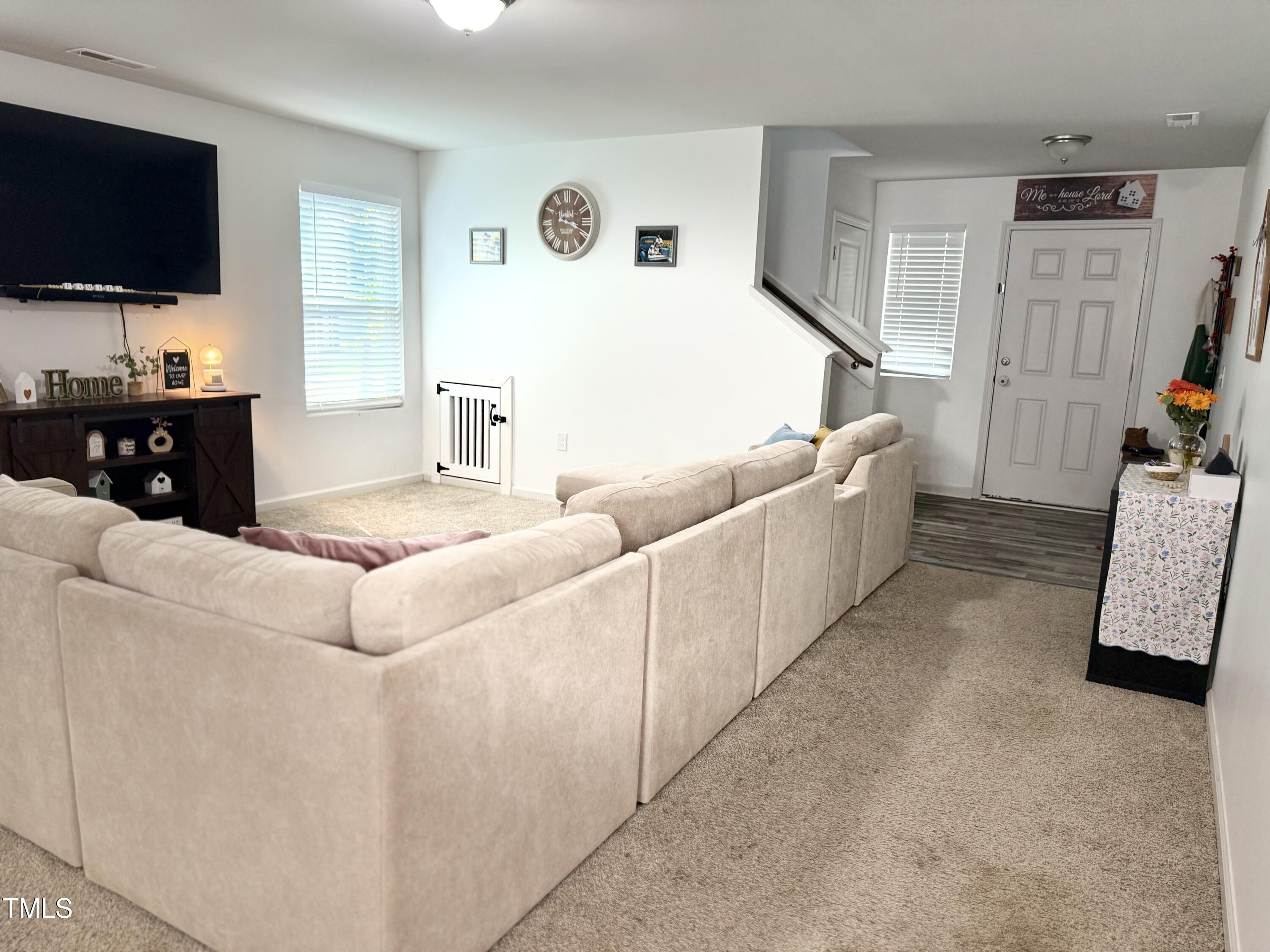 150 Riley Way Spring Hope, NC 27882 - Photo 10 of 27 a living room with furniture and a flat screen tv