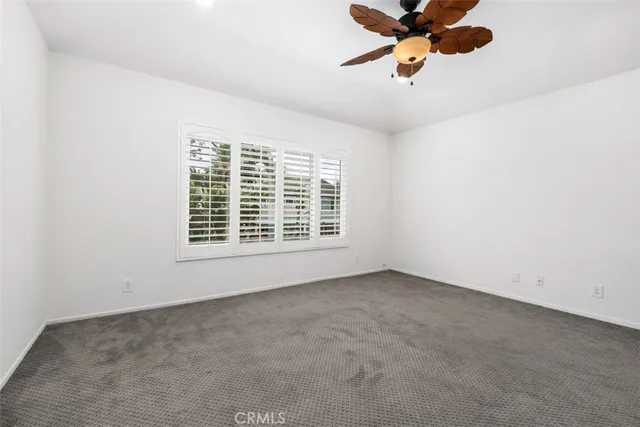 a bathroom with a granite countertop tub sink and mirror