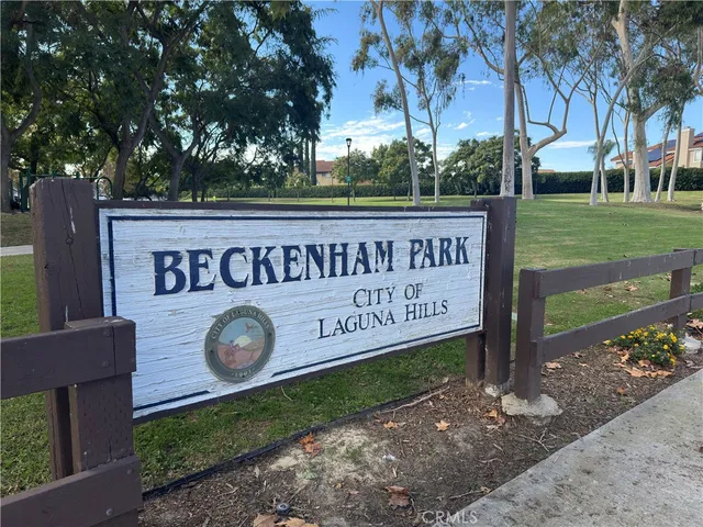 a view of a swimming pool with sitting area and slide
