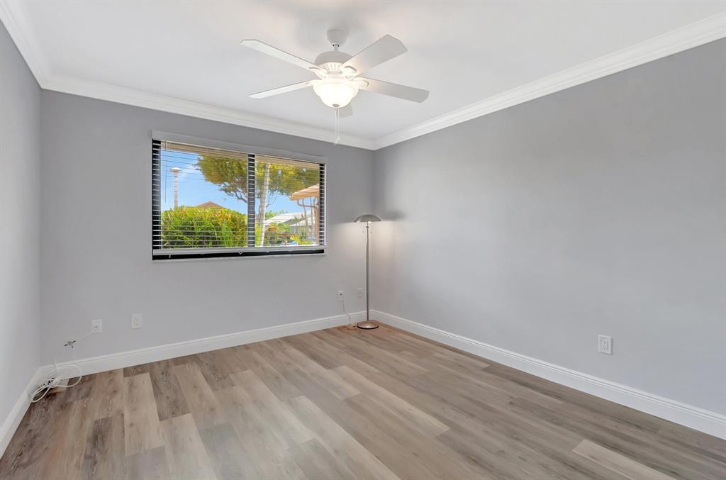 3180 Northwest 13th Street Delray Beach, FL 33445 - Photo 17 of 52 an empty room with a window