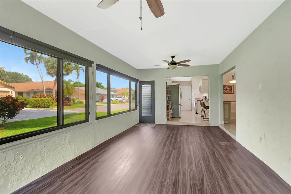 3180 Northwest 13th Street Delray Beach, FL 33445 - Photo 24 of 52 a view of hallway with wooden floor and windows