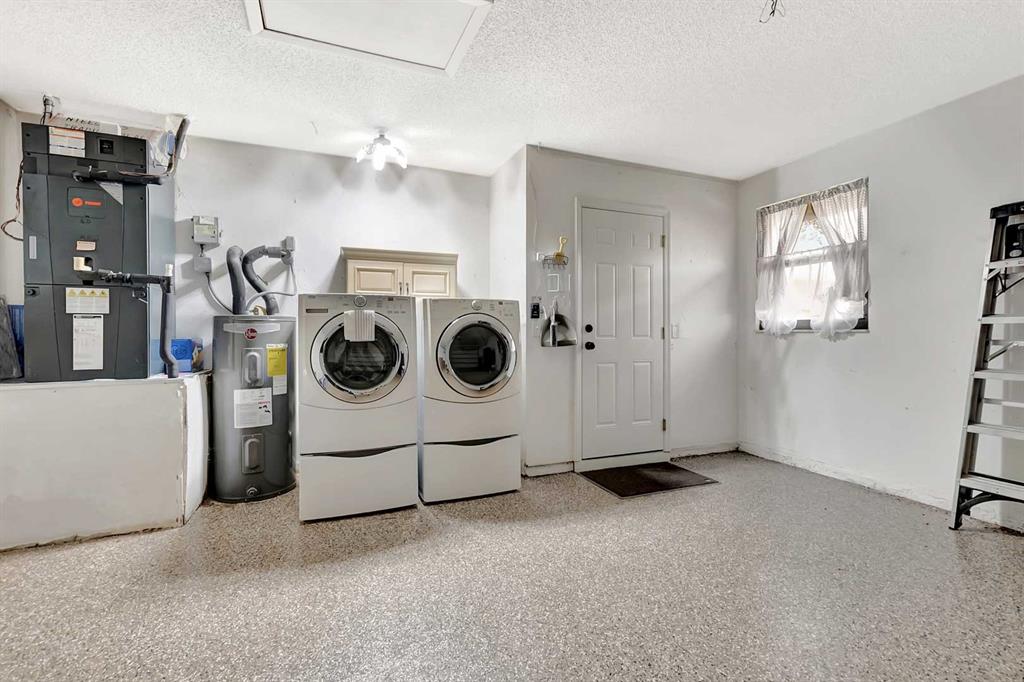 3180 Northwest 13th Street Delray Beach, FL 33445 - Photo 25 of 52 a utility room with dryer and washer