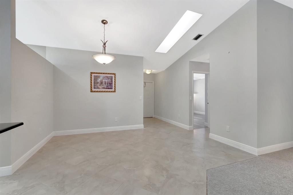 3180 Northwest 13th Street Delray Beach, FL 33445 - Photo 5 of 52 a view of an empty room with a window