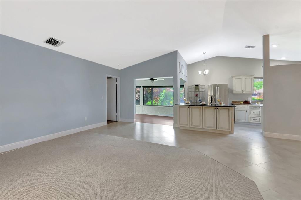 3180 Northwest 13th Street Delray Beach, FL 33445 - Photo 6 of 52 a view of a kitchen with a sink and a stove