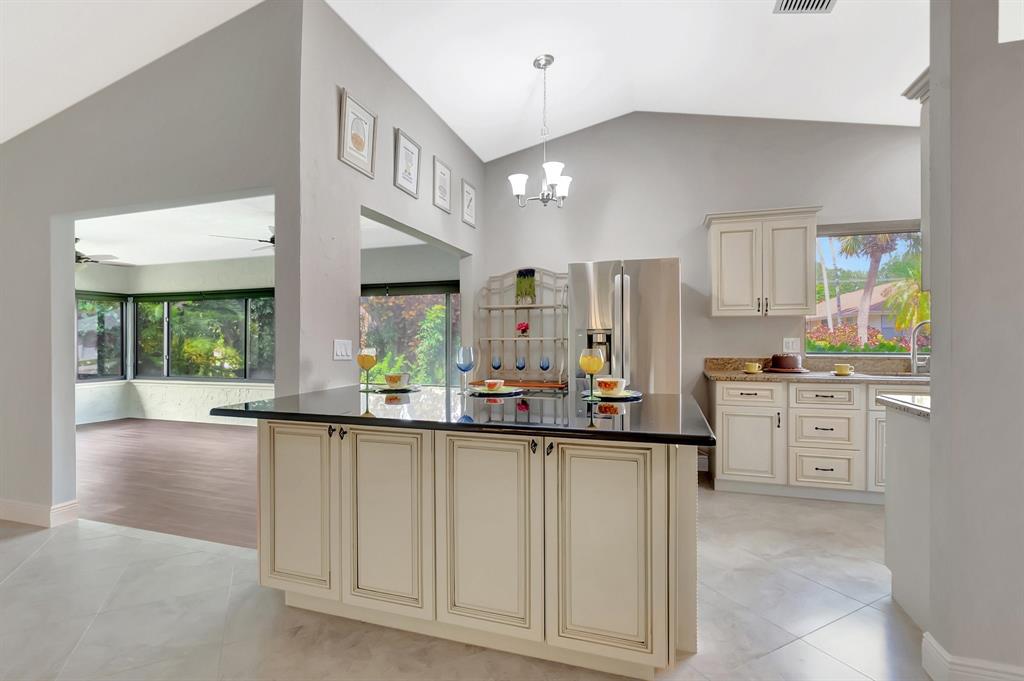 3180 Northwest 13th Street Delray Beach, FL 33445 - Photo 10 of 52 a kitchen with white cabinets and appliances