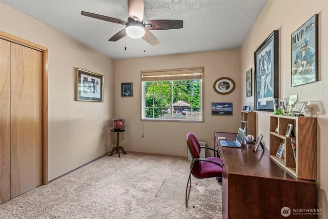 a workspace with furniture and window