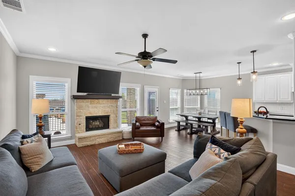 a living room with furniture fireplace and a flat screen tv
