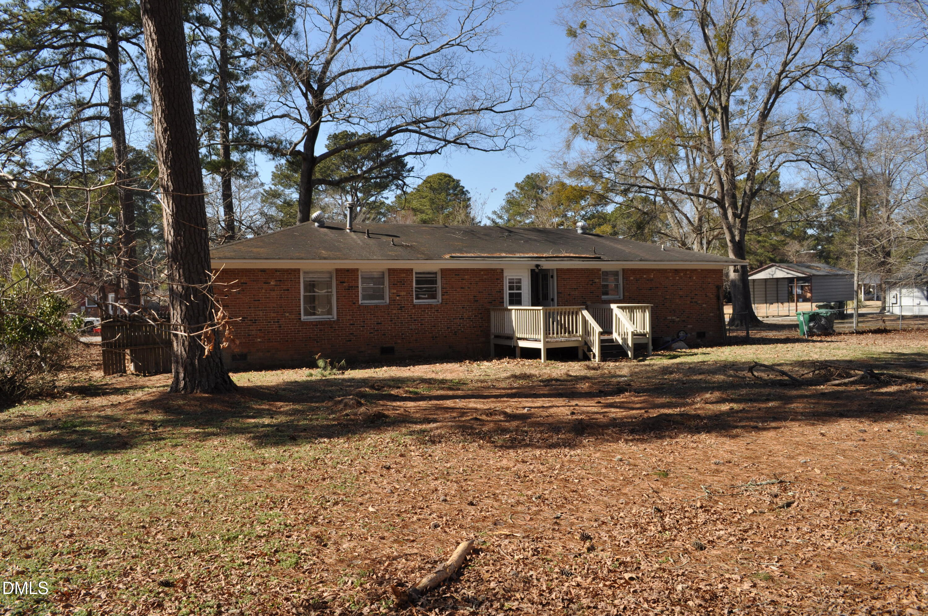 403 Huntington Road Tarboro, NC 27886 - Photo 12 of 42 a view of a house with a yard covered with snow