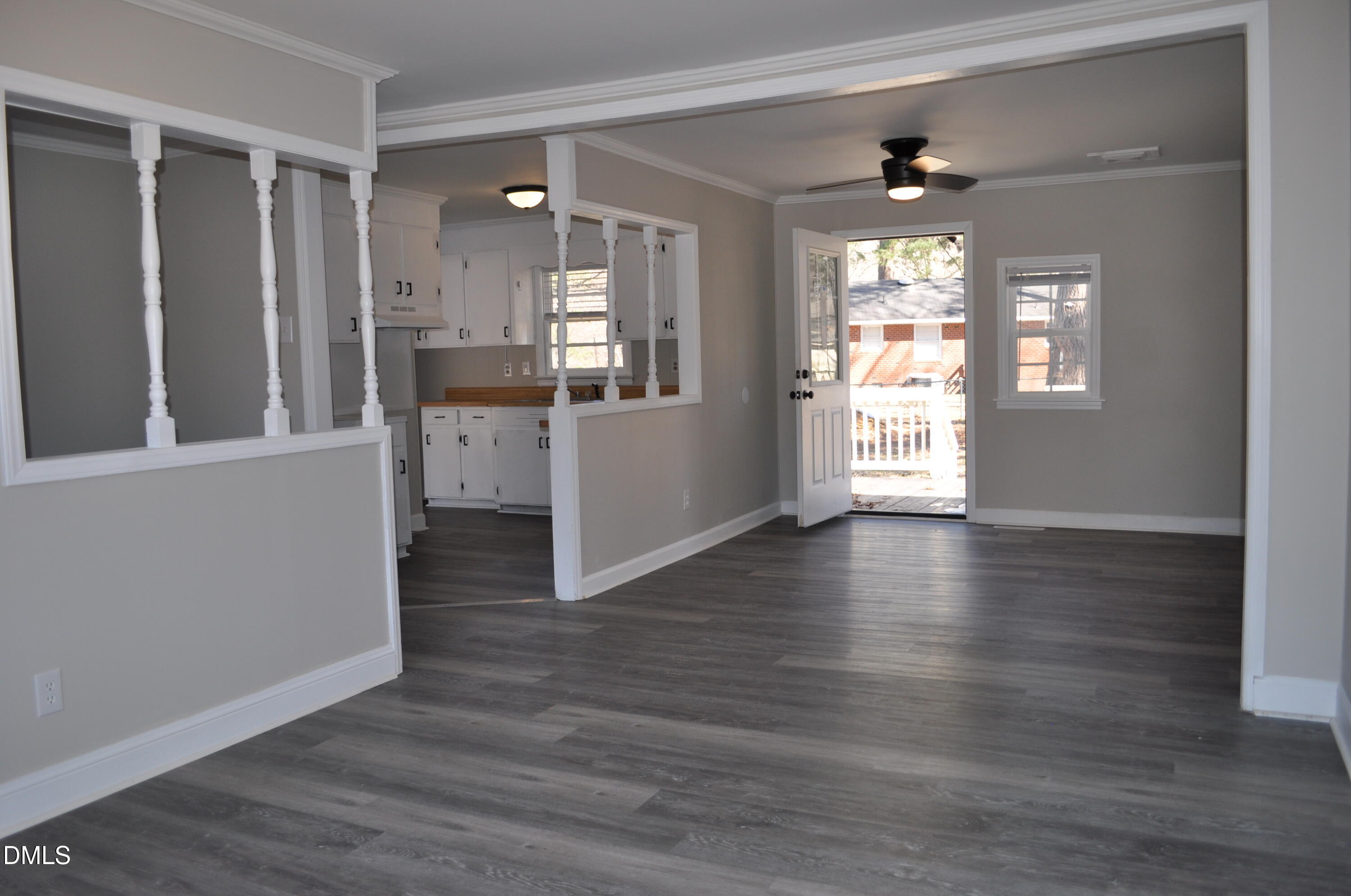 403 Huntington Road Tarboro, NC 27886 - Photo 17 of 42 an empty room with wooden floor and windows