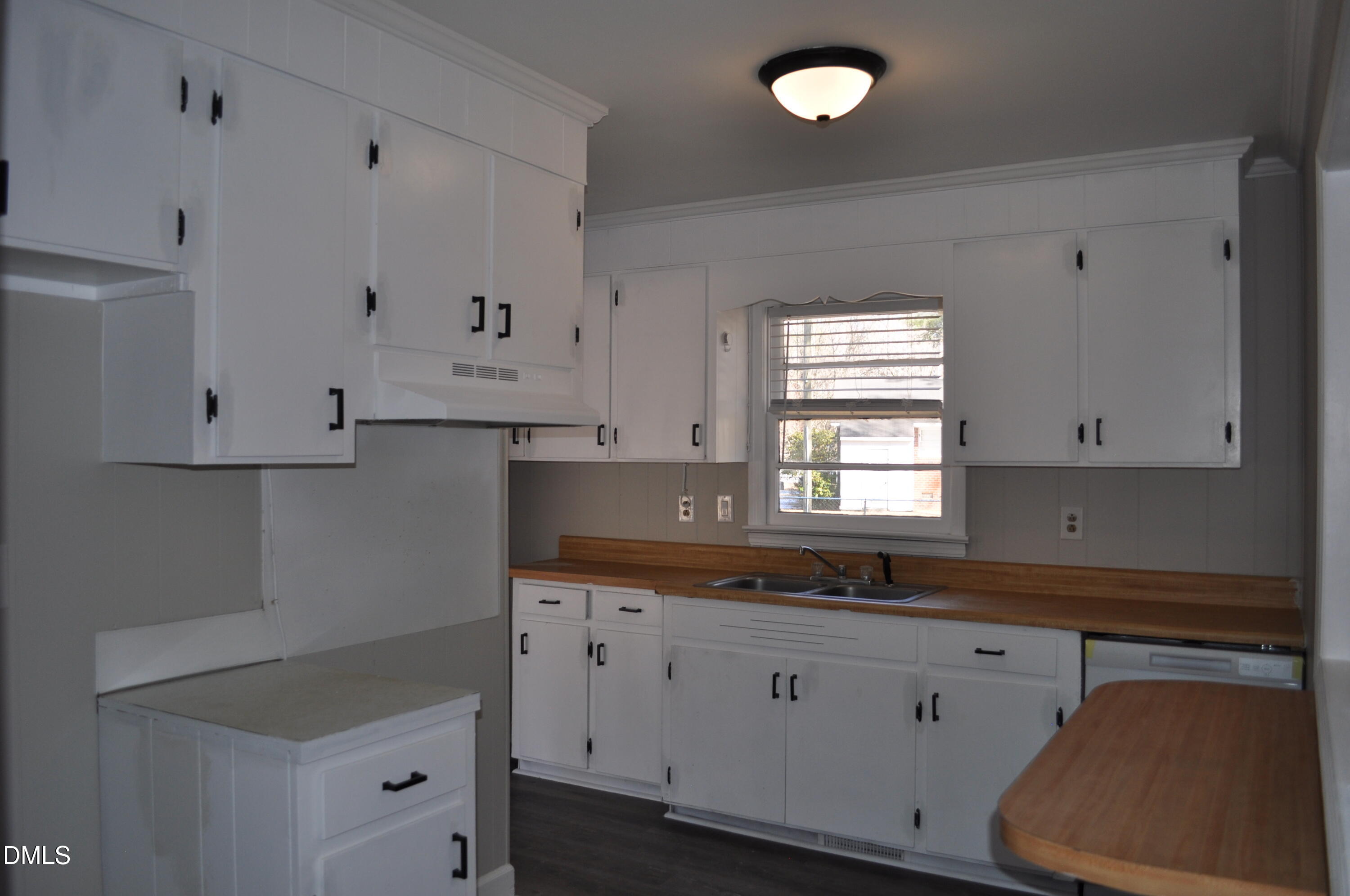403 Huntington Road Tarboro, NC 27886 - Photo 18 of 42 a kitchen with granite countertop white cabinets and white appliances