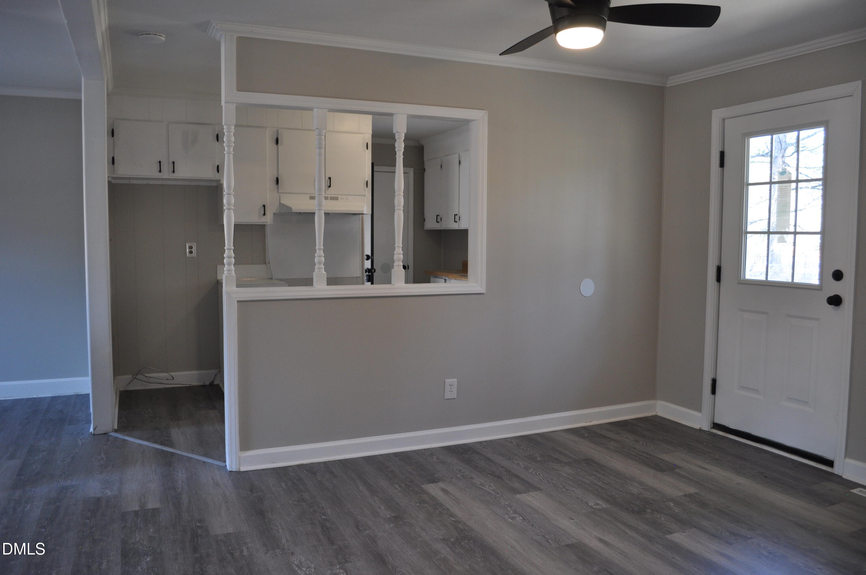 403 Huntington Road Tarboro, NC 27886 - Photo 35 of 42 an empty room with wooden floor and windows