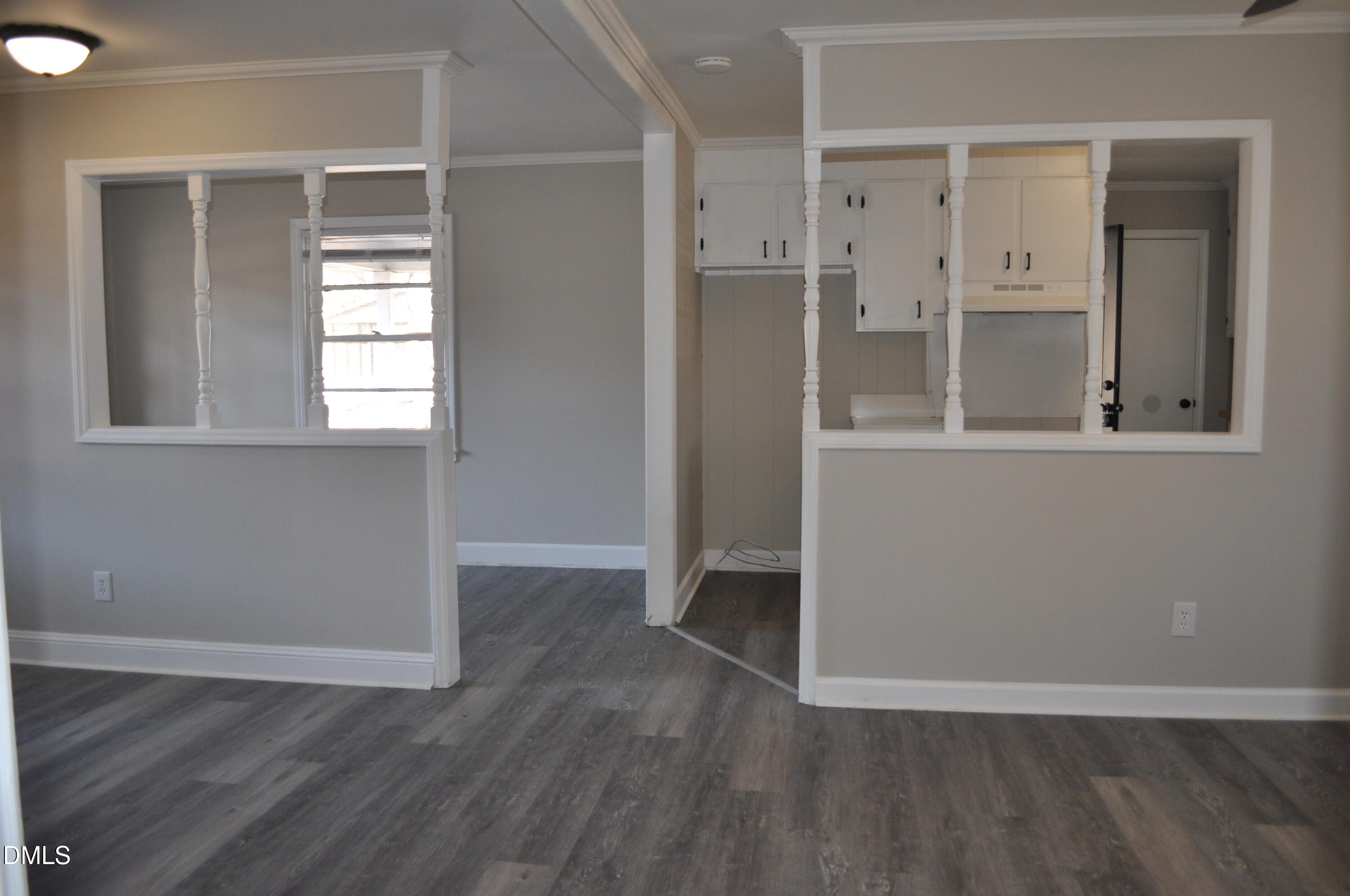 403 Huntington Road Tarboro, NC 27886 - Photo 36 of 42 an empty room with wooden floor and windows
