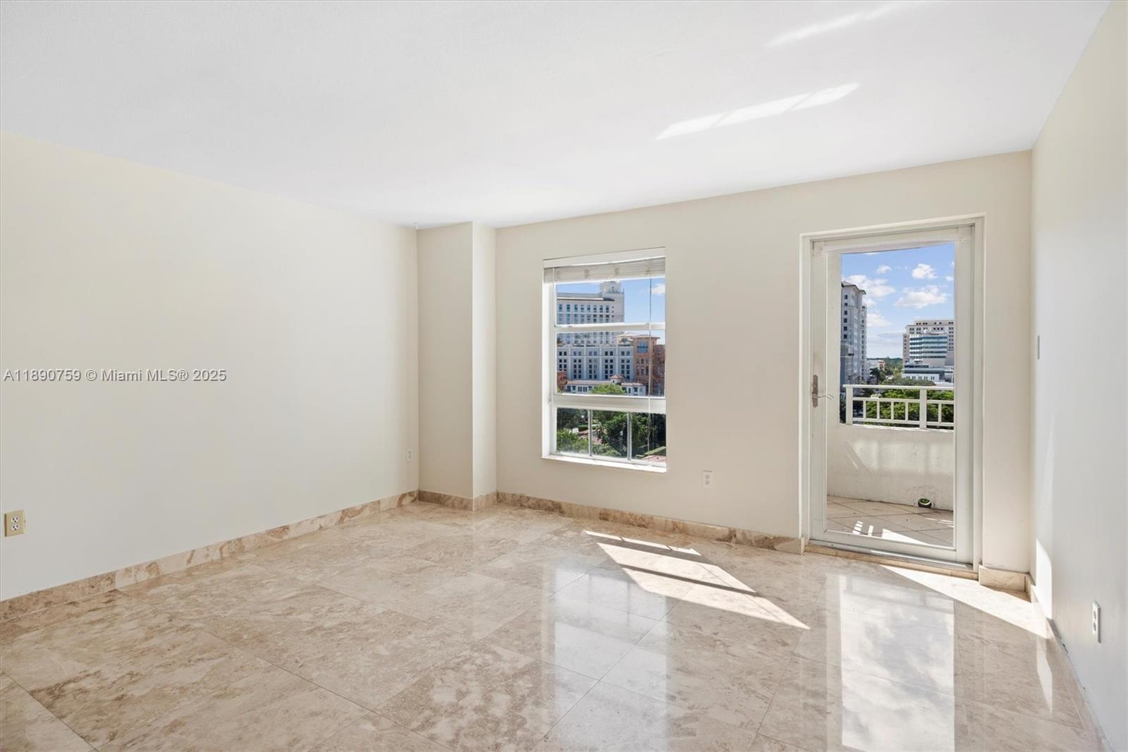 2351 Douglas Road, Unit 906 Miami, FL 33145 - Photo 11 of 45 an empty room with a window