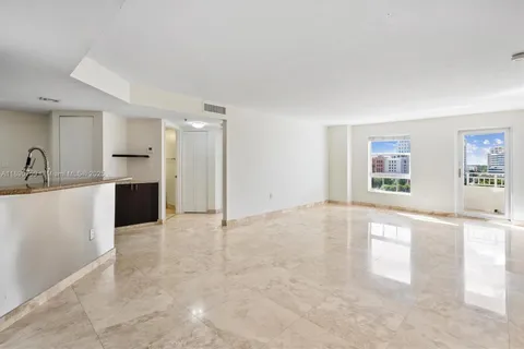 a view of a kitchen with a sink and a window