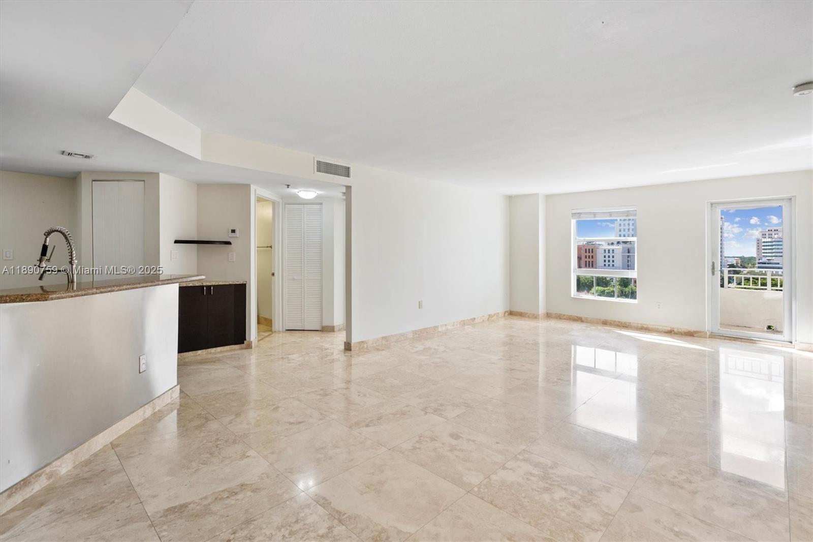 2351 Douglas Road, Unit 906 Miami, FL 33145 - Photo 14 of 45 a view of a kitchen with a sink and a window