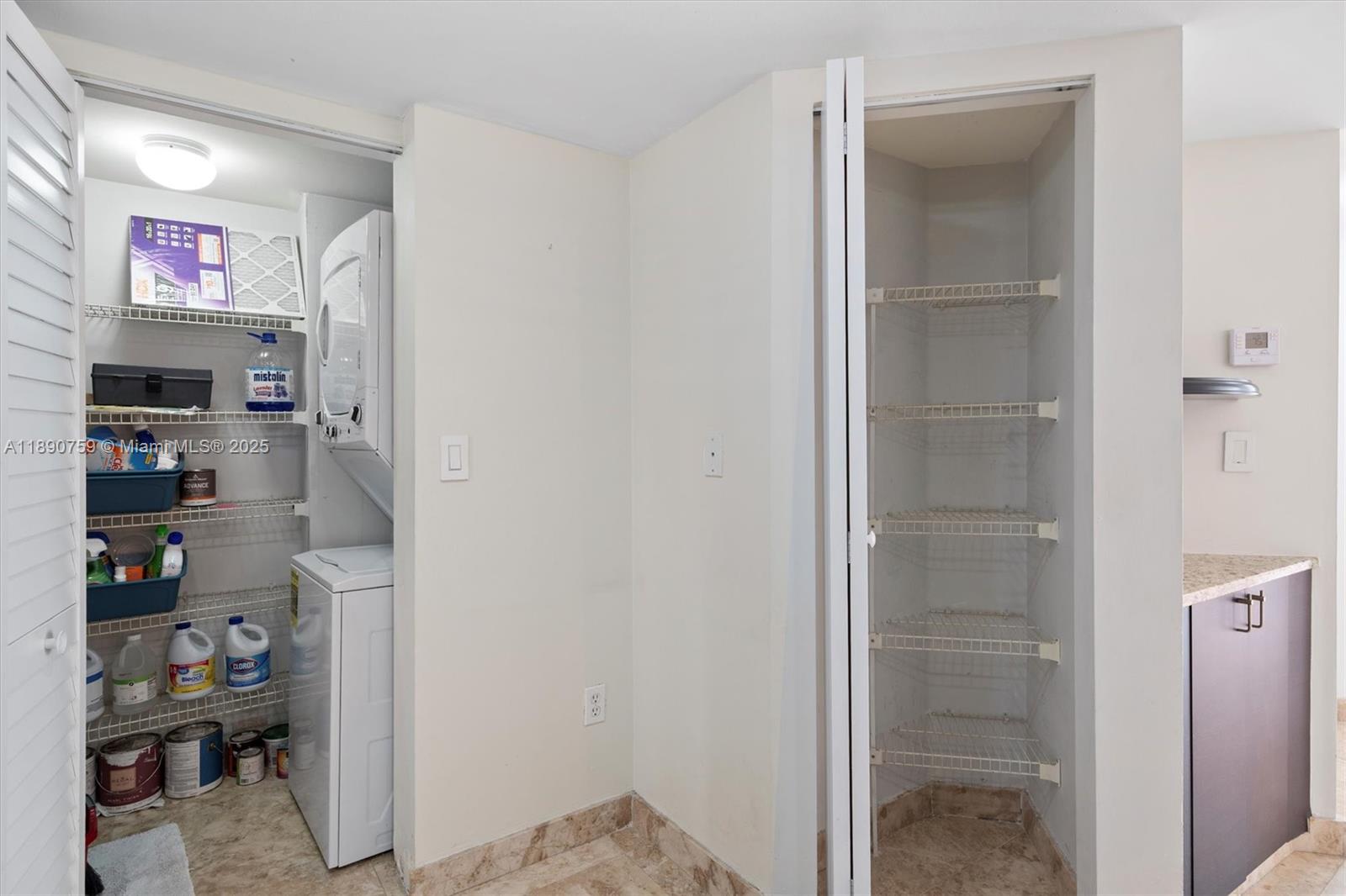 2351 Douglas Road, Unit 906 Miami, FL 33145 - Photo 17 of 45 a view of walk in closet with clothes and shoes